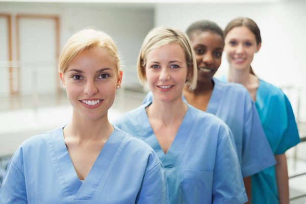 Female nurse looking at camera in hospital hallway-1